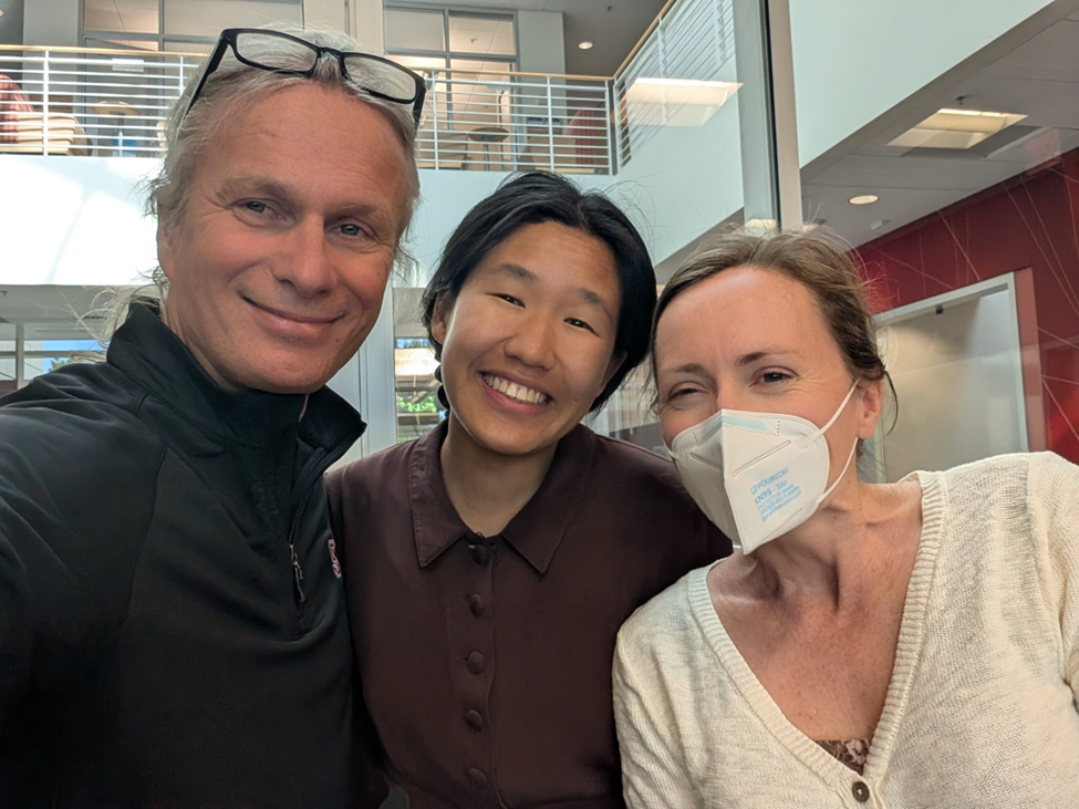 Giulio De Leo, Rani Chor, and Jamie Hansen pose for a picture together during the 2025 SWAP Year-end Showcase. They are all smiling.