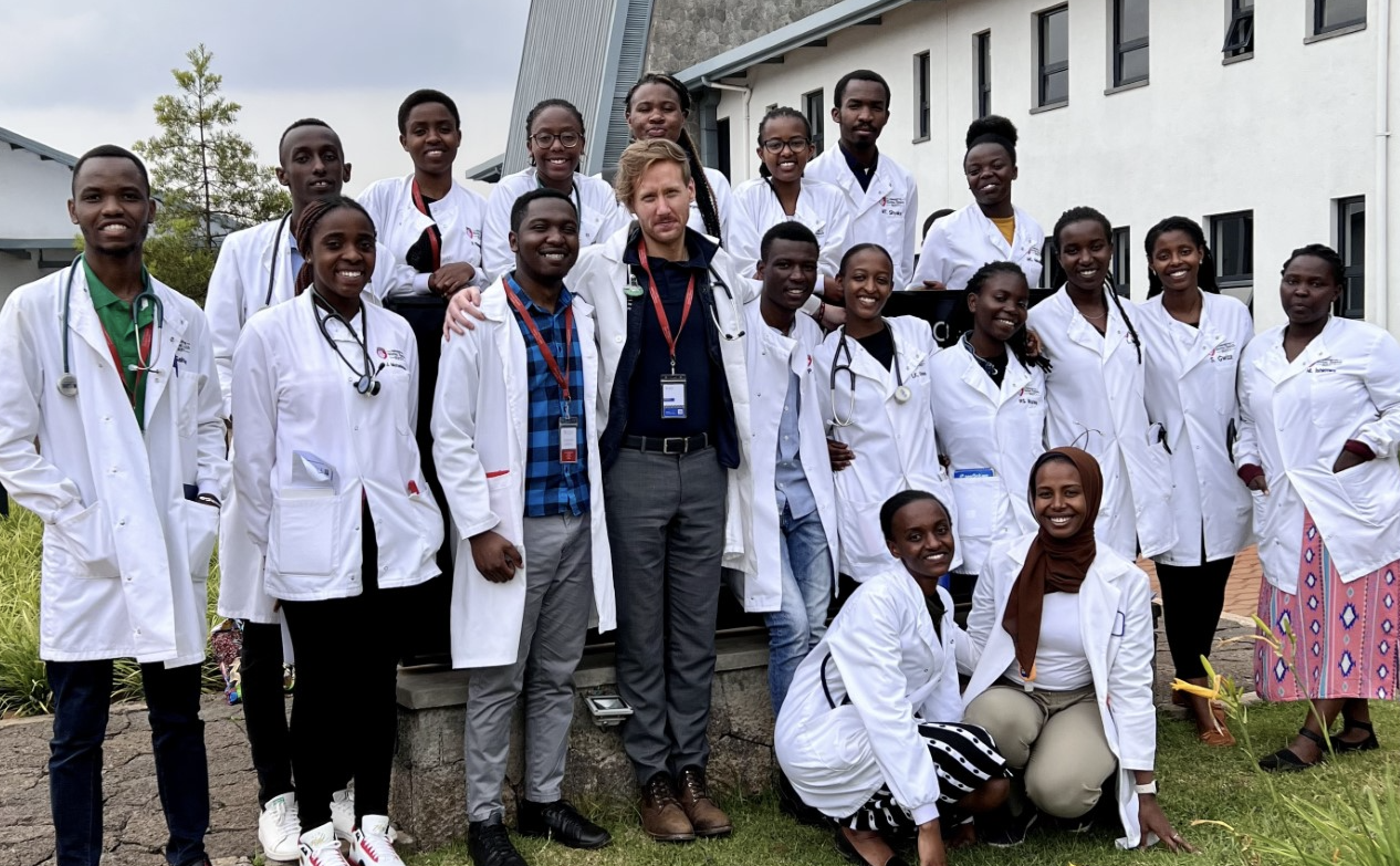 MEdical resident Andrew Enslen with medical students at UGHE in Rwanda
