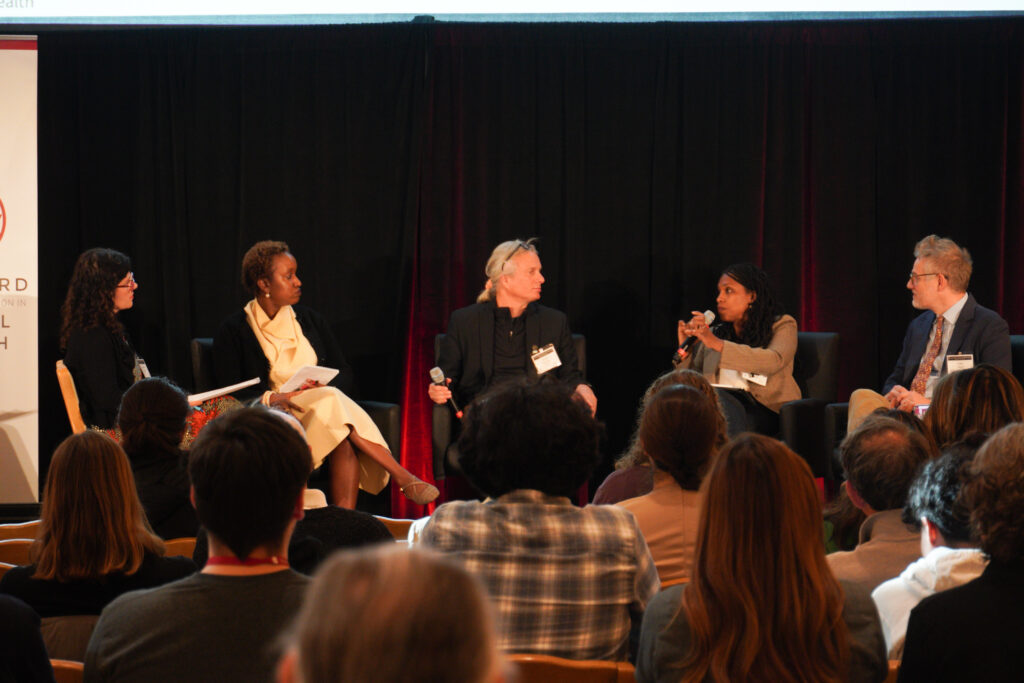 A panel of global and planetary health experts present to a crowded room at the 2026 Global Health Research Convening about reimagining global and planetary health