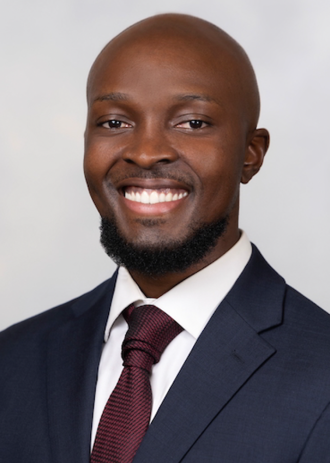 Christian Takou Mbah in a suit and tie