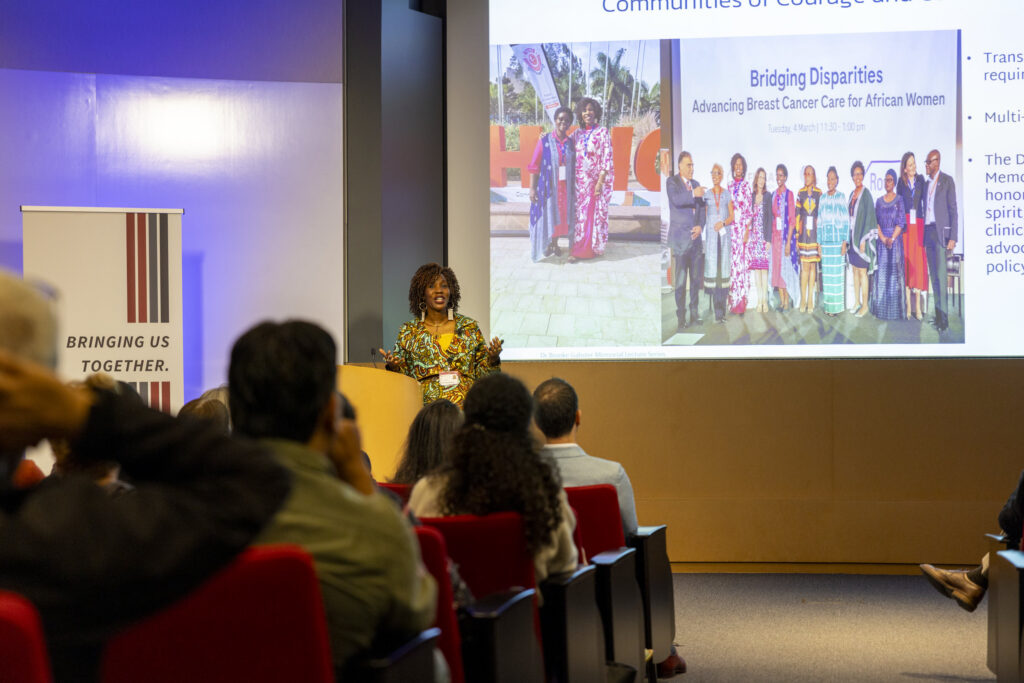 SASH Scholar Miriam Mutebi speaks at the Stanford Medicine Grand Rounds.
