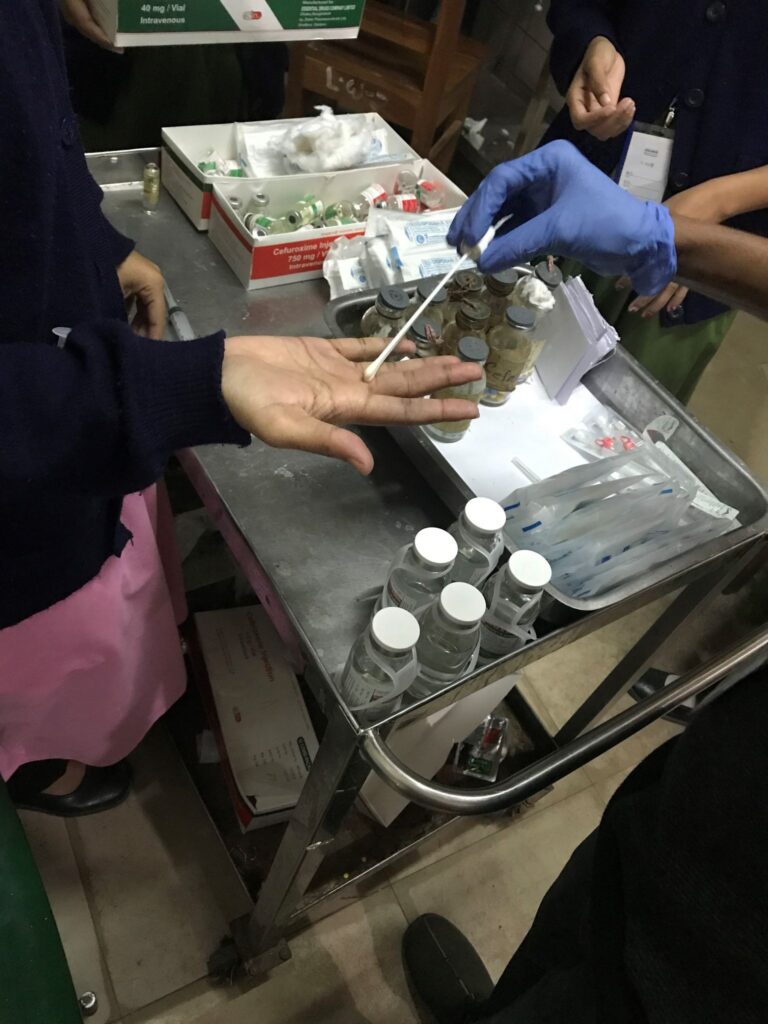 A sample is collected from a healthcare worker's hand in Bangladesh to identify possible sources of antimicrobial resistance in a perinatal hospital ward.