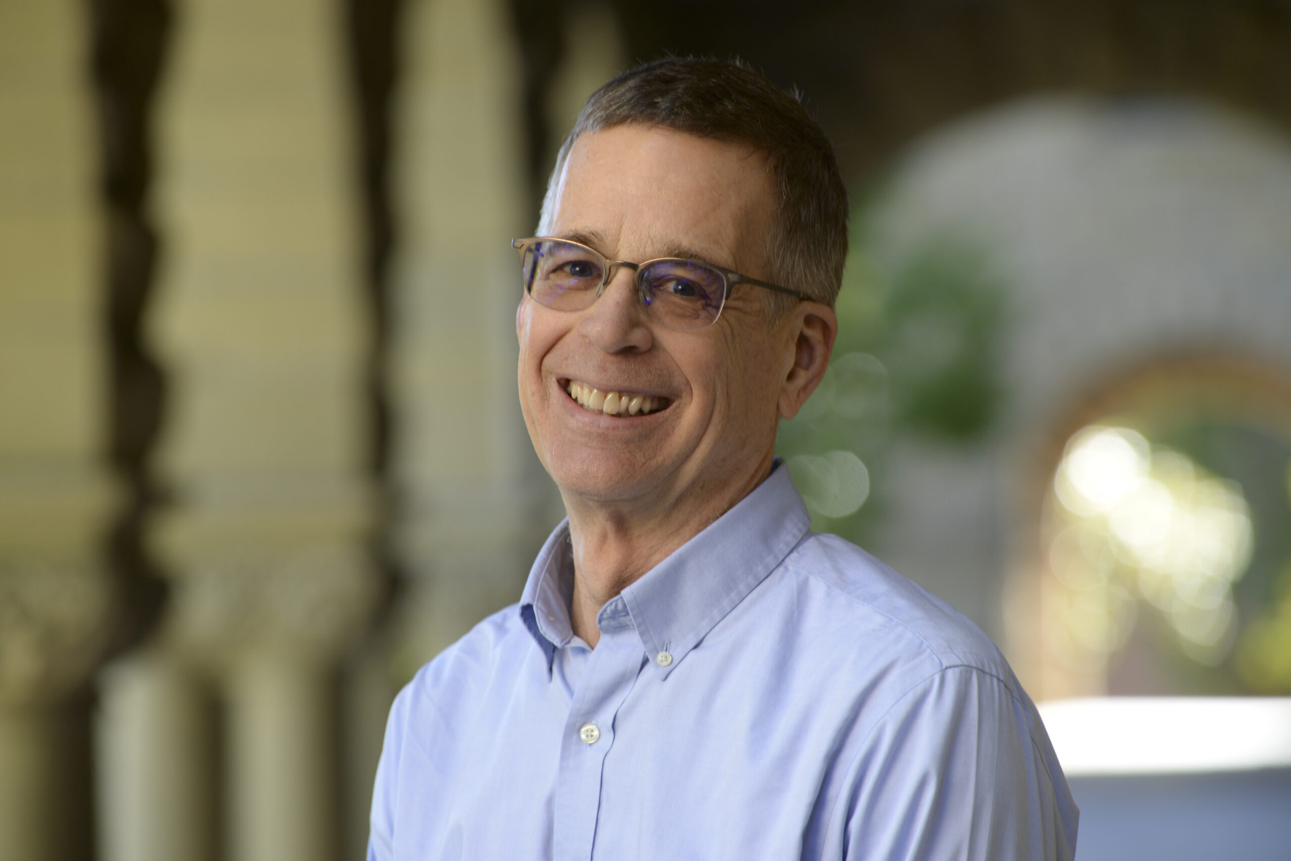 Steve Luby smiling at Stanford
